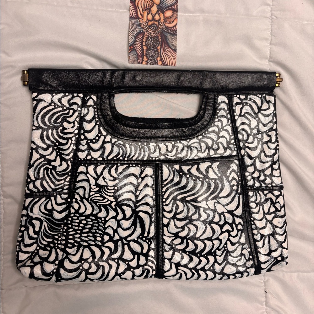 Hand panted one of a kind black and white clutch purse.